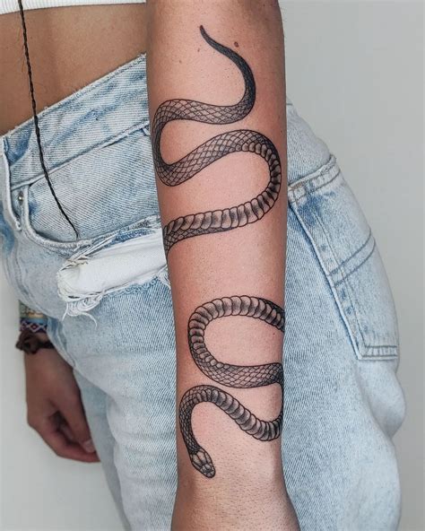 snake wrapped around arm tattoo|16 Snake Tattoos Wrapped Around Arm Inspiration